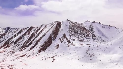 snow peaks mountains curved through dangerous road winter view