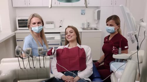 Woman Smiles During Dental Exam in Office