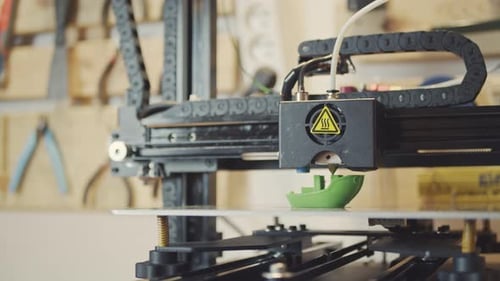 Black 3D Printer Printing Green Toy Ship Cinematic 4K