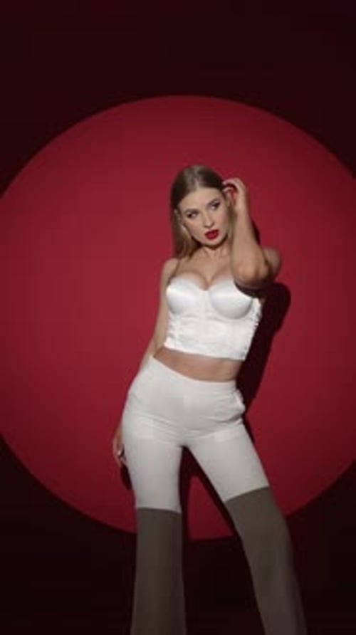 Young Sexy Girl with Bright Makeup and Deep Sexy Cleavage