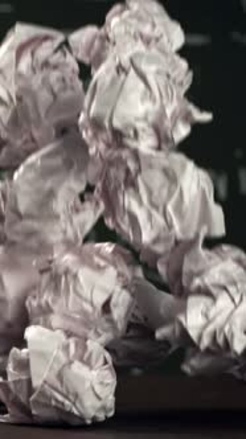 Crumpled Paper Falls on the School Desk Filmed on a Highspeed Camera at 1000 Fps