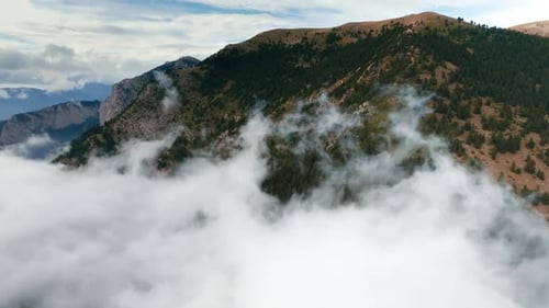 Tranquil Mountain Landscape Aerial View From Drone Flying Above Clouds
