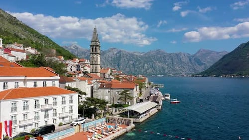 View of the historic town of Perast at famous Bay of Kotor on a beautiful sunny day with blue sky an
