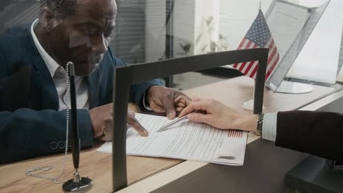 Embassy Clerk Requesting Businessman to Correct Mistake in Visa Application