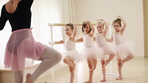 Ballet Class with Children Practicing at the Barre