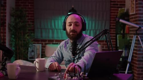 Man Recording Podcast in Modern Studio at Night