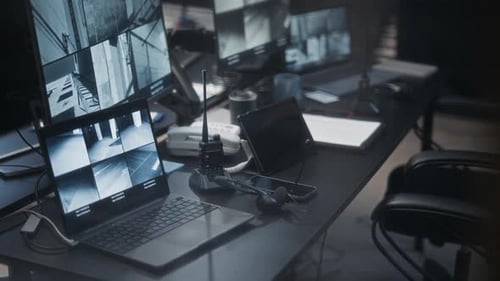 Security Room Filled with Computer Monitors and Equipment