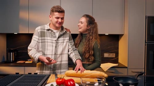 Couple Making Food Together in Modern Kitchen
