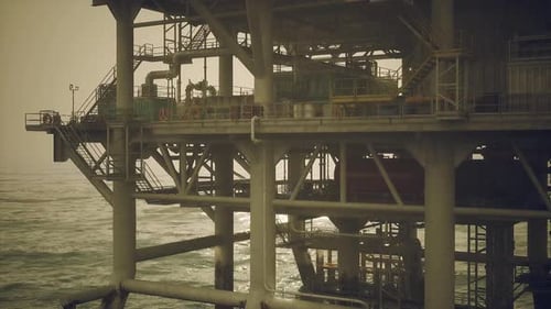Oil Rig Structure Operating in Ocean Waters During Overcast Conditions