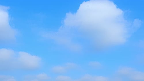 Clouds Drifting Across a Blue Sky