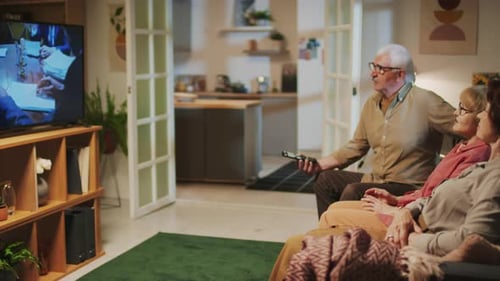 Seniors Relaxing, Watching Television at Home