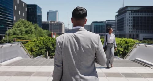 Walking, travel and back of businessman in city with commuting or journey on stairs in morning