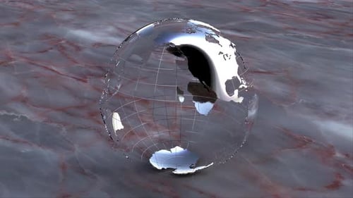 Reflective Metallic Globe on Marble Surface