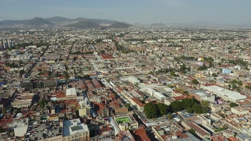 Aerial View of Mexico City Neighborhood During Daytime, Dolly Back Pan Up