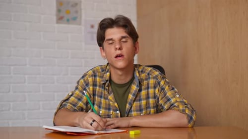 Man College Student Studying at Home Pov Sitting at Desk Listening Watching Lesson Online on