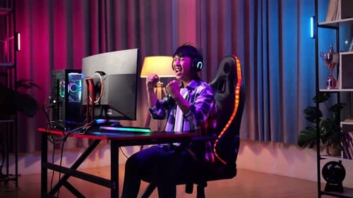 Excited Young Gamer Celebrates a Victory