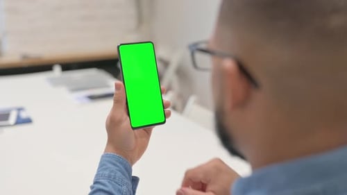 African Man Using Phone with Green Screen