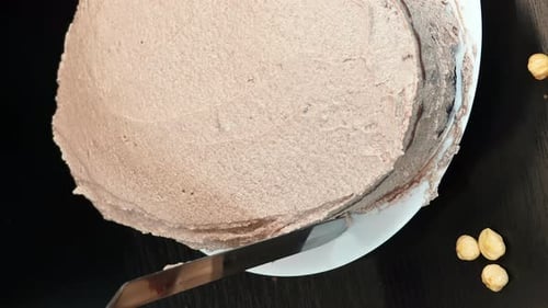 Cake with Hazelnut Frosting being Frosted