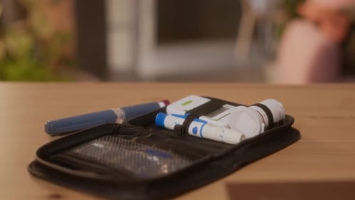 Diabetes Medical Kit and Insulin Pens on Table