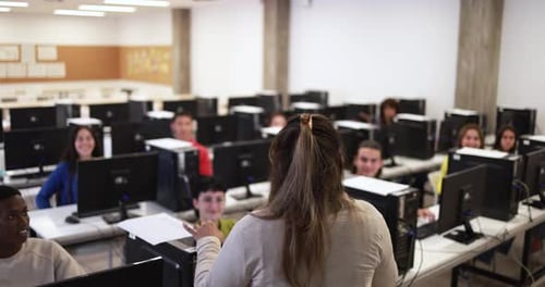 Young Multiracial Students Using Computers at School Class Academic