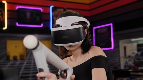 Closeup of a Young Girl Playing a VR Game in an Entertainment Center