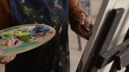 Artist with Palette Painting on Easel