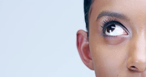 Woman, eye and close up in studio for beauty, lenses eyecare or microblading skincare
