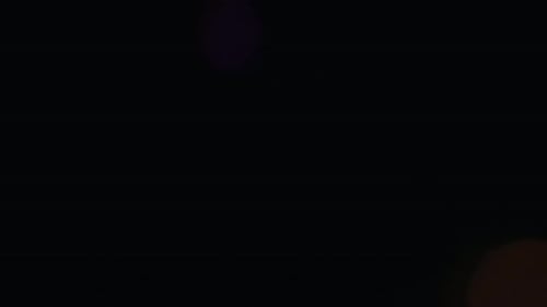 Abstract Overlay with Purple Blurred Light Transition Lens Flare Flashes Effects on Dark Background