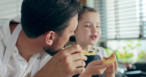 Close Up Shot Selective Focus on Bearded Father and Preschooler Curious Daughter Eating Homemade