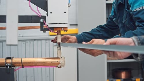 Metalworking Machine Creates a Hole in a Metallic Structure During Production
