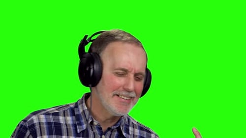 Man Enjoying Music with Headphones on Green Screen