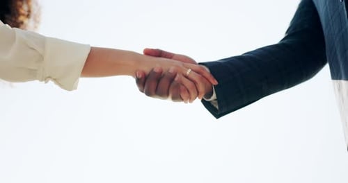 Hands Clasped Together, Engagement Ring in Sunlight