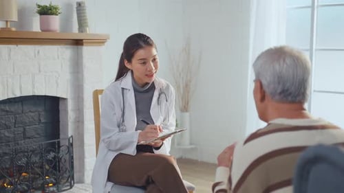 Doctor Consults Senior Patient at Home