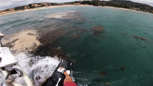 Beautiful first person pov shot of kitesurfer riding through polluted sea kitesurfing with kitesurf