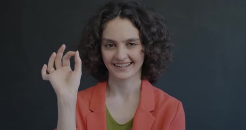 Woman Giving Okay Hand Sign Close Up