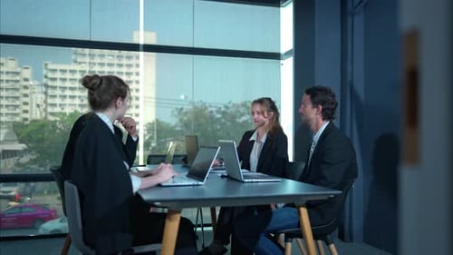 Dynamic Business Meeting in Bright Office Setting