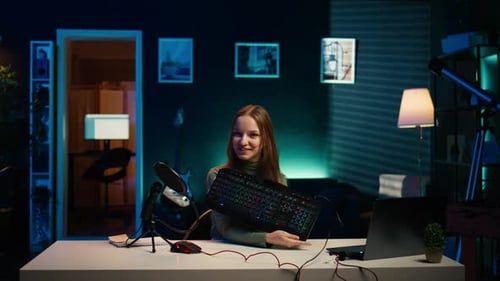 Woman Shows RGB Keyboard and Mouse to Camera
