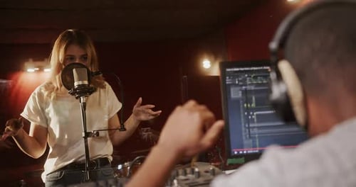 Woman Sings in Music Recording Studio