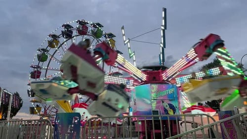 Amusement Park Roller Coaster and Ferris Wheel at Sunset in Dartmouth Canada