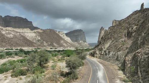 Aerial View Of Truck Driving Along Empty Road Through Arid Desert Land At Hingol National Park. Push