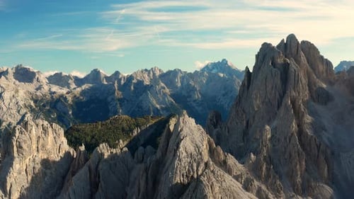 Rocky Tops of Three Peaks of Lavaredo Above Canyon at Sunset