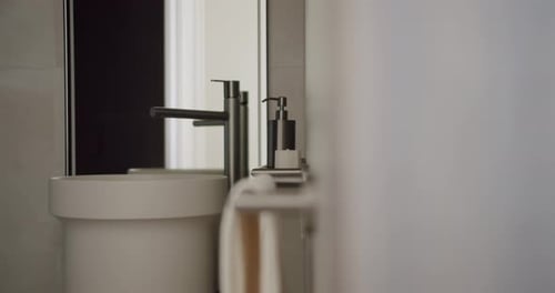 Modern Sink and Faucet in Minimalist Bathroom