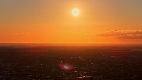 Golden Sunset over Cityscape with Aerial Drone View