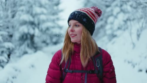 Portrait Woman with Backpack Stand Smiling Alone in the Winter Mountains in Forest Road Sport