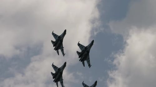 Four Fighter Jets Flying in Formation