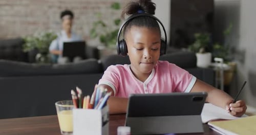 Girl Studying at Home Using a Tablet
