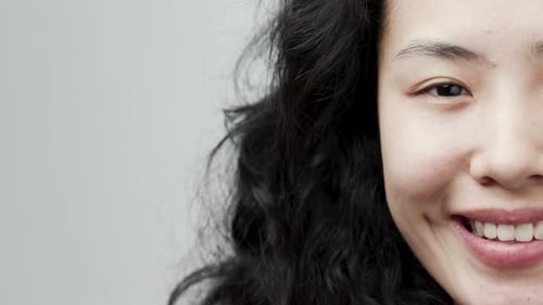 Woman smiles in a beauty close up shot