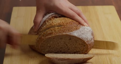 Slicing Wholegrain Bread Cri On Slice For Bruschetta Cutting Sourdough Bread On Kitchen Making
