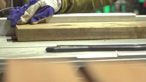Carpenter Cutting Wooden Plank With Table Circular Saw . Carpenter Working On A Circular Saw Machine