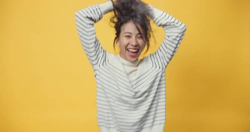 Woman Shakes Her Head and Celebrates